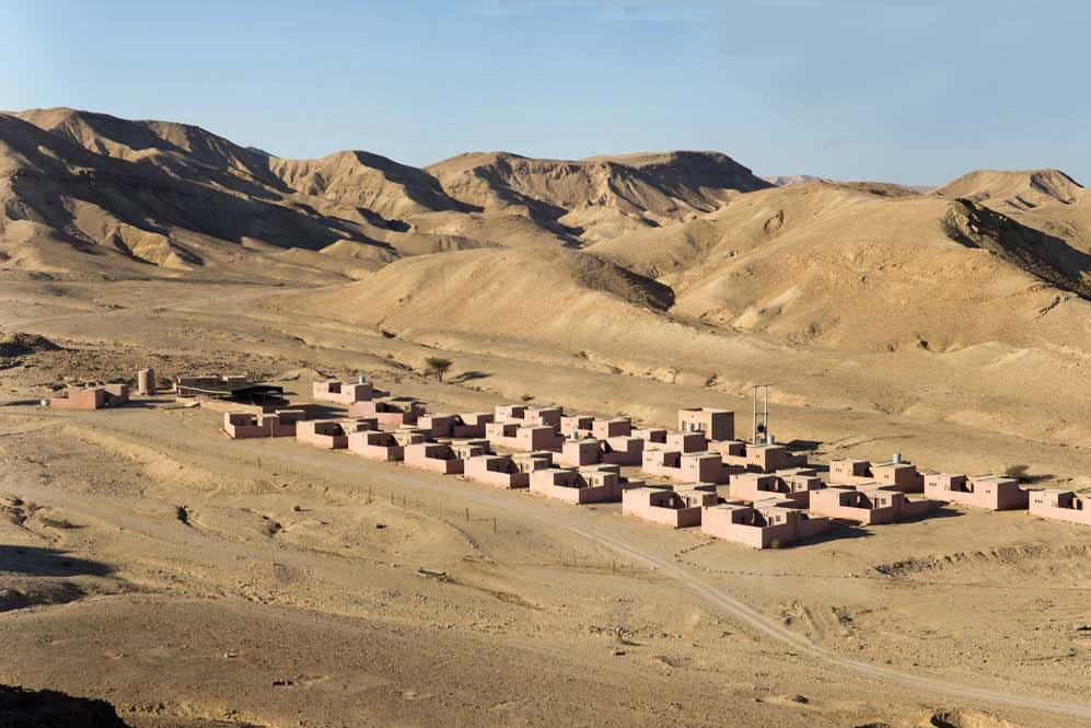 View of ruins at Bir Madkhur, Jordan, with mountains in the background